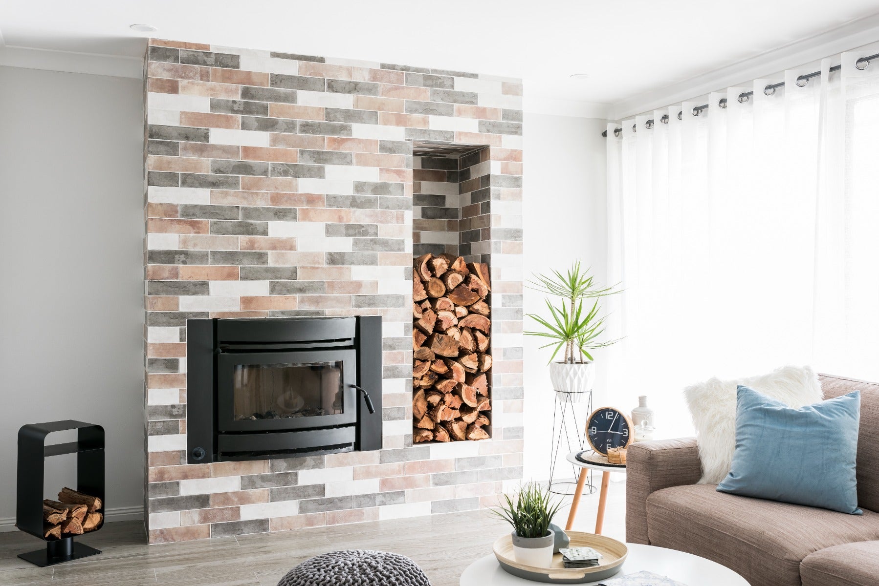 colourful subway tiles laid on a fireplace from amber