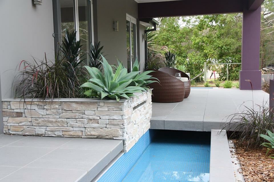 veneerstone stackstone cladding on a pool feature from amber
