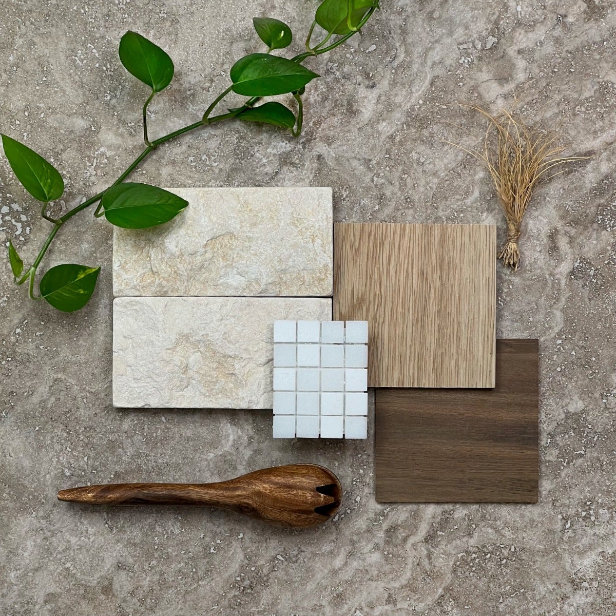 A flat lay featuring a rustic country aesthetic, showcasing natural textures and earthy tones. The composition includes a variety of materials available at Amber, such as reclaimed wood planks, weathered stone tiles, and textured fabrics in muted shades. the overall vibe is warm, inviting, and perfectly suited for creating a cozy, country-inspired interior.