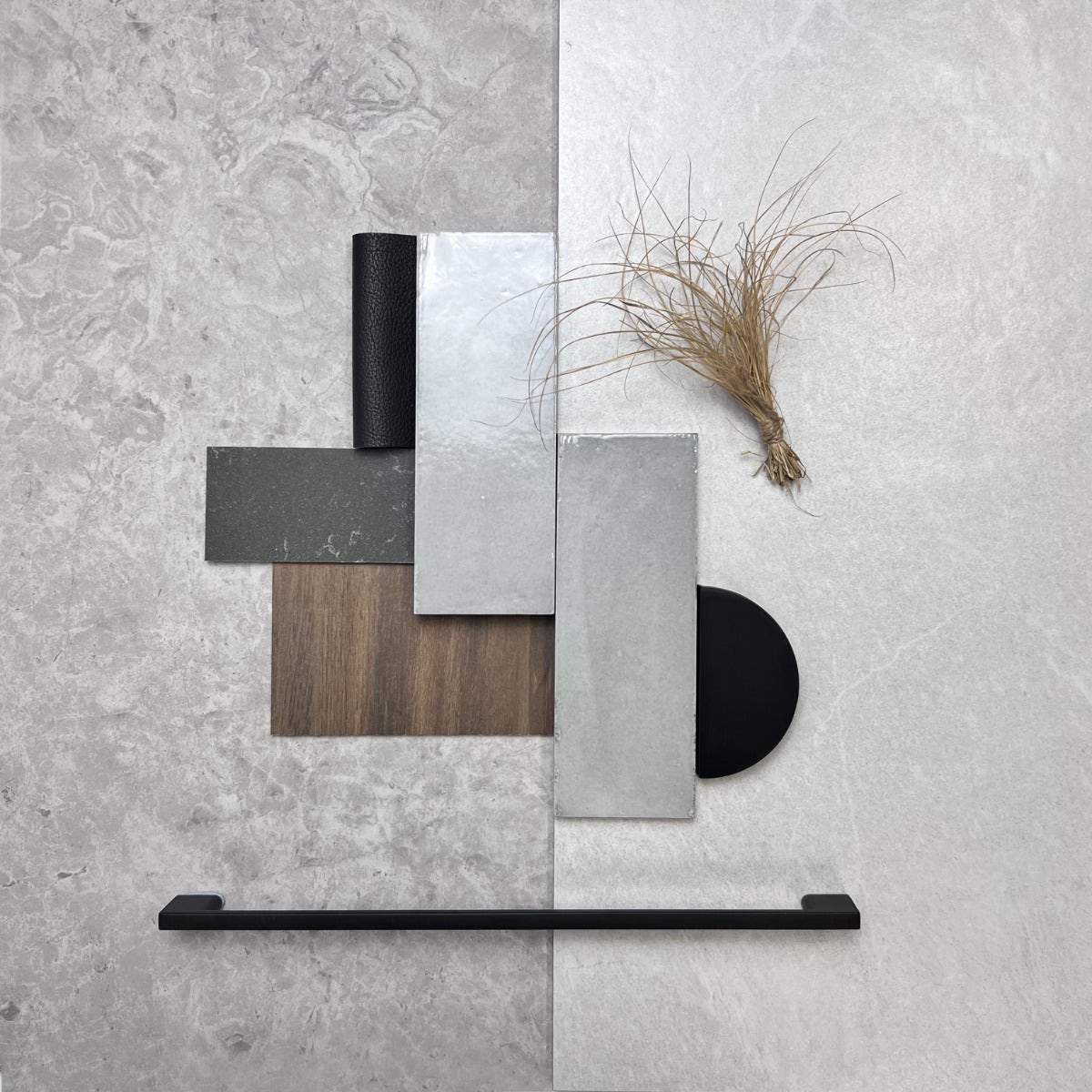 A modern minimalist flat lay featuring sleek, neutral-toned tiles from Amber. The composition includes a mix of large format and small subway tiles in soft greys and whites, arranged with precision to highlight their clean lines and subtle textures.