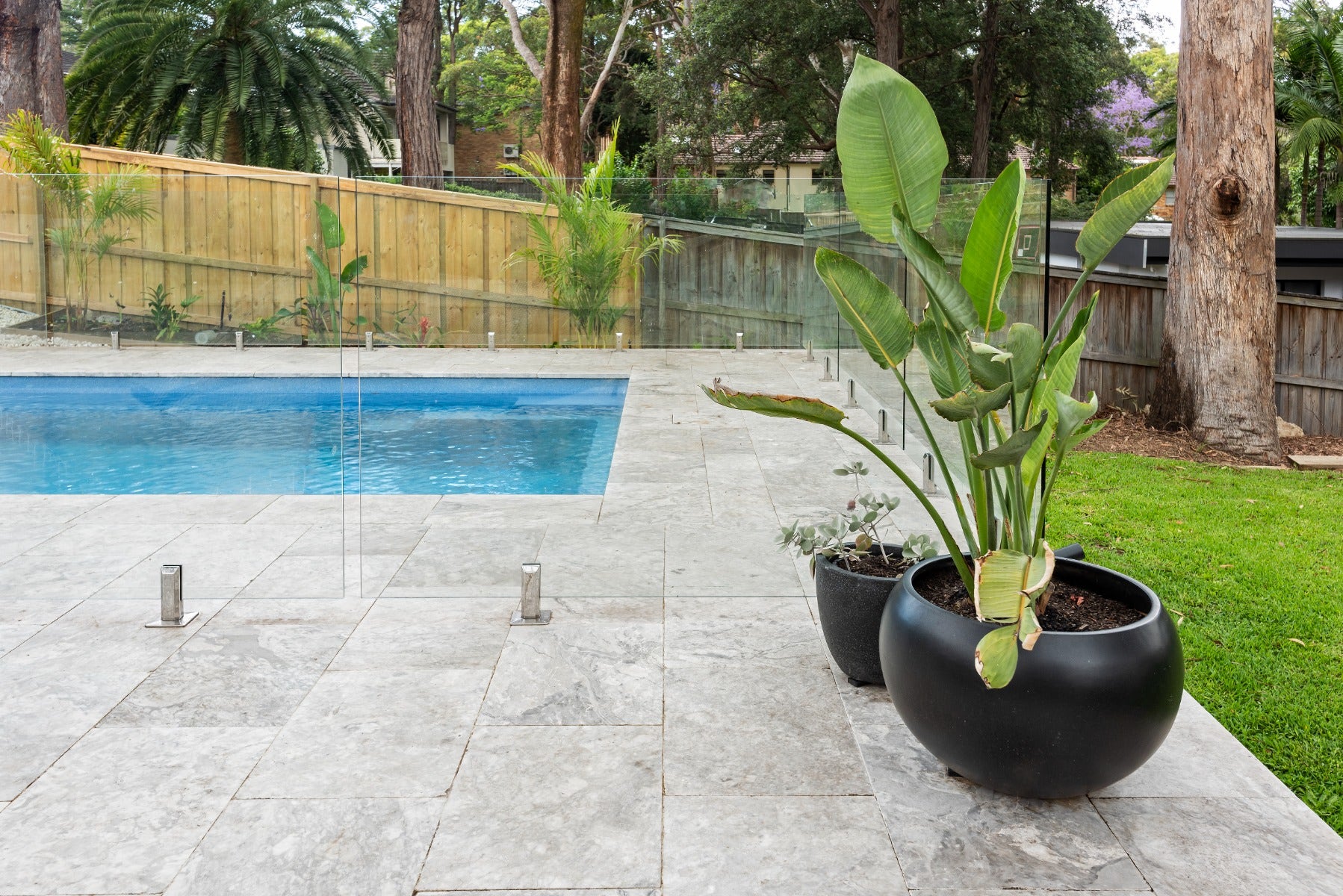 outdoor pool with marble pavers