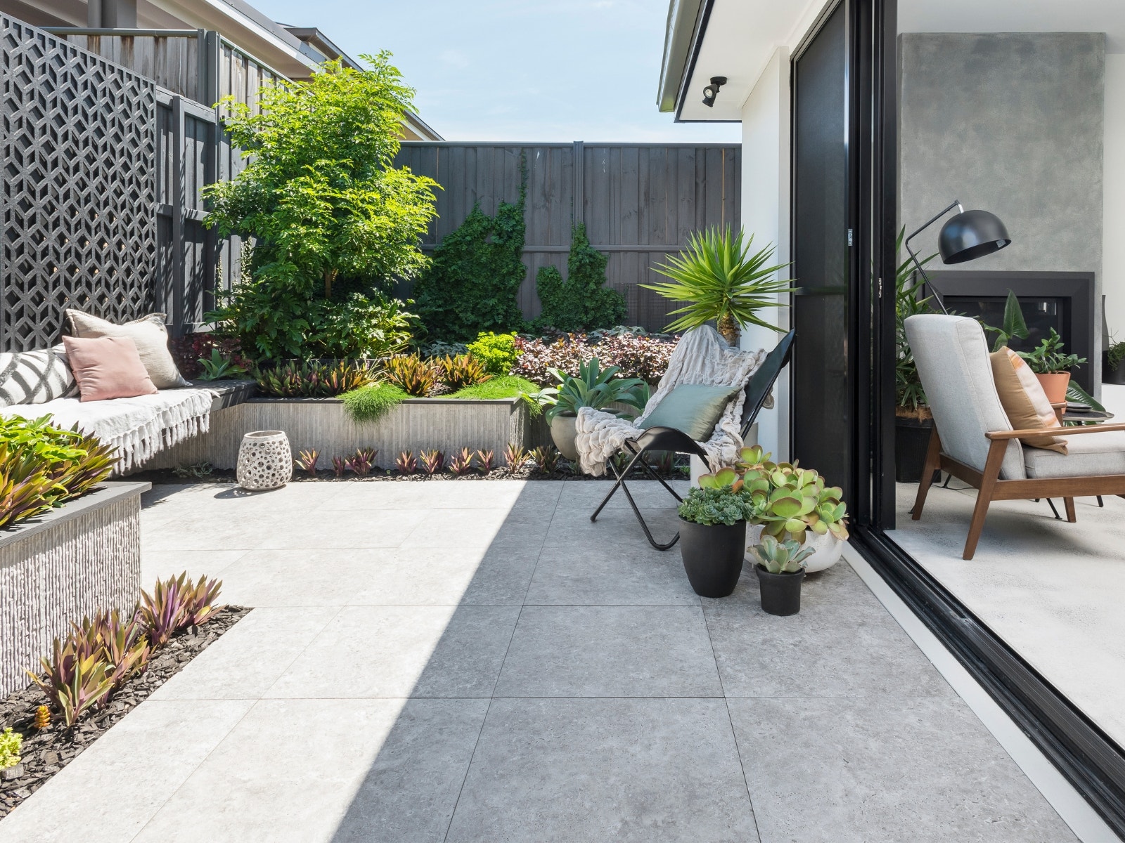 contemporary style alfresco using grey travertine look porcelain pavers from amber
