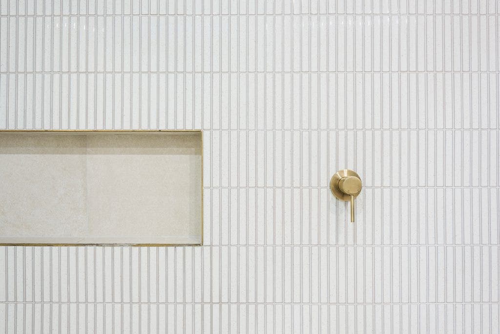 white kitkat mosaics in bathroon