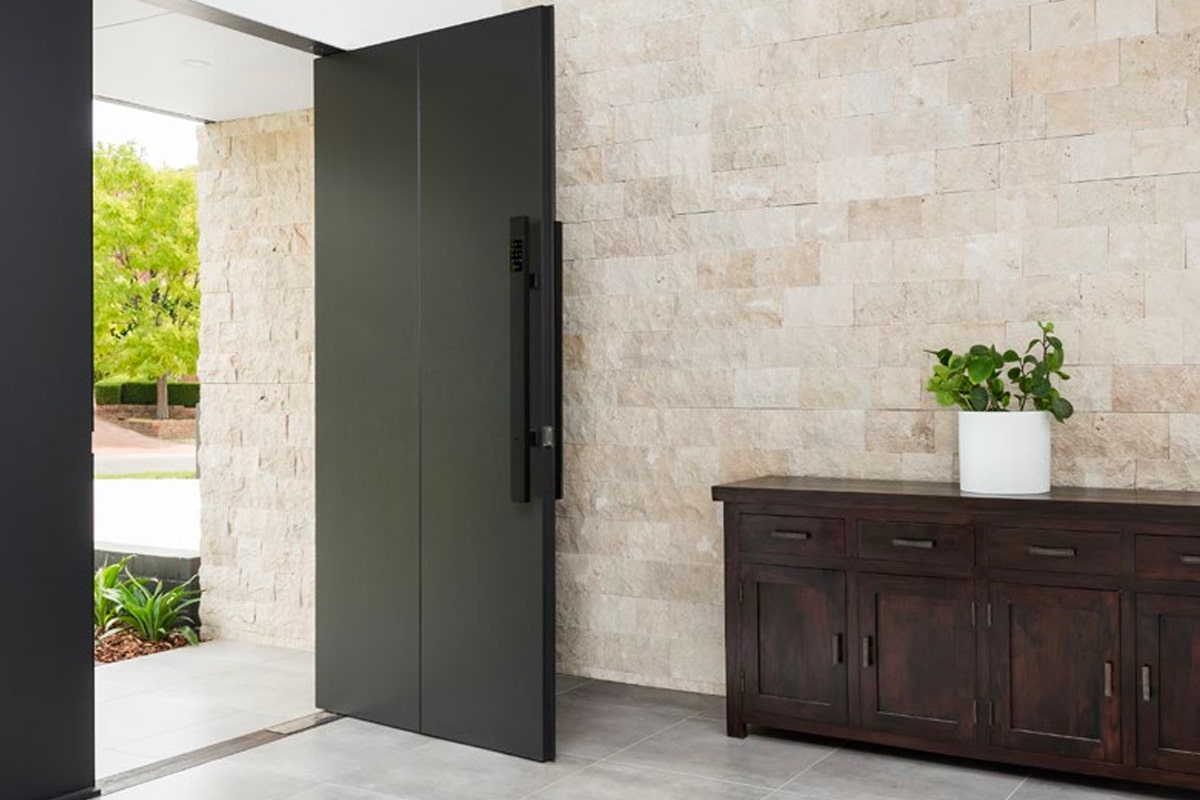 natural stone wall cladding used at the entrance of a coastal home from amber